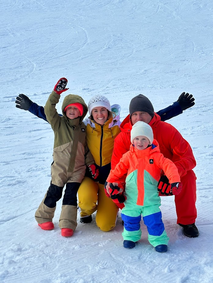 Byron and his family in the snow.